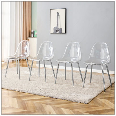 Ensemble de 4 chaises de salle à manger modernes et transparentes avec pieds en métal plaqué, conception ergonomique et assemblage facile.