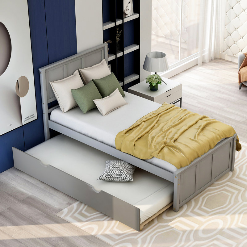Lit plateforme gris élégant avec lit gigogne peu encombrant et structure en bois massif durable pour les chambres modernes