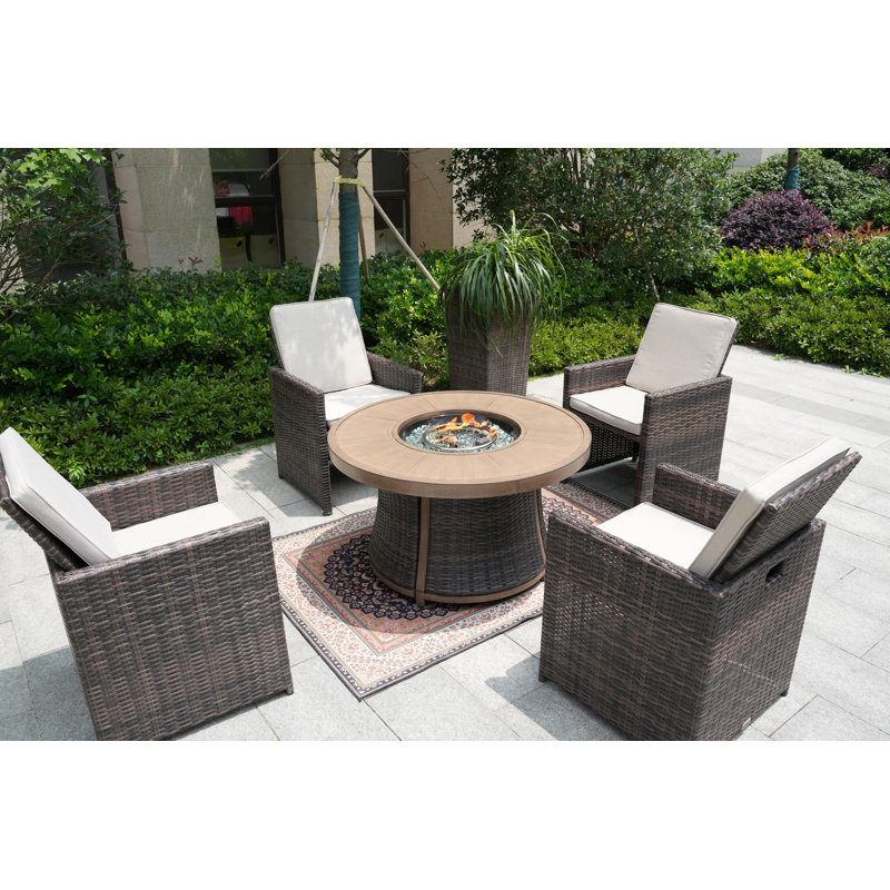 Areefa 4 - Person Wicker Patio Dining Set with Round Table , Cushions Included