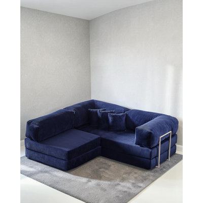 Canapé modulaire en L en velours bleu avec assise basse