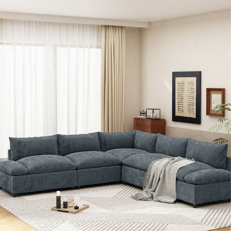 Canapé modulaire moderne gris foncé avec coussins et espaces de rangement dissimulés