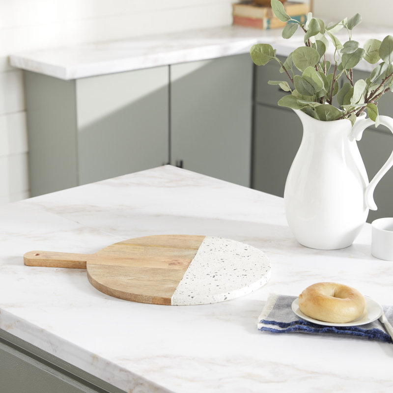 Brown mango wood cutting board with terrazzo details
