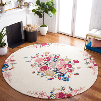 Delmarie Hand Tufted Wool/Cotton Floral Rug in Pink/Red/Ivory