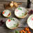 Pomodoro 38 oz stoneware Pasta Bowls – Set of 4 – 9 Inch Round Bowls with Lifelike Printed Tomato Vine Design – Rustic Italian-Inspired Serveware for Pasta, Salads, and Harvest Dishes – Vibrant Mediterranean Kitchen Decor