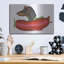«Black Dachshund In Red Plane» par Danny Gordon-599272917