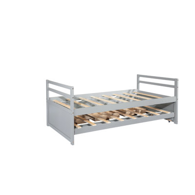 Lit simple gris avec tête de lit élégante, lit gigogne et options de rangement