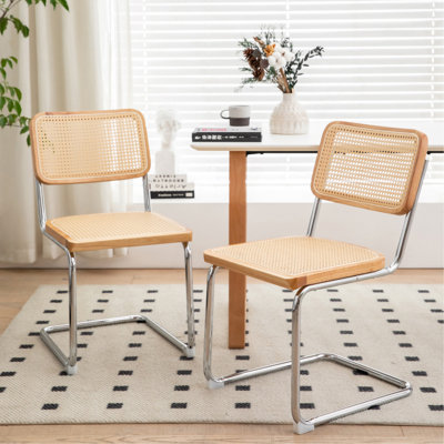 Ensemble de 2 chaises de salle à manger élégantes en velours avec pieds chromés, idéales pour les espaces modernes et contemporains.