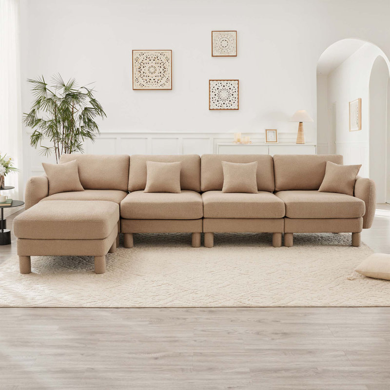Canapé 4 places Boucle avec accoudoirs distinctifs en forme de coquillage, 1 repose-pieds amovible et pieds cylindriques - enveloppé de tissu