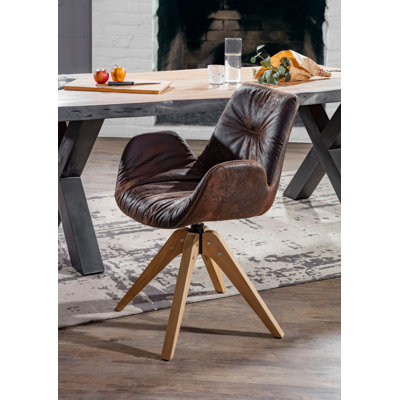 Brada Upholstered Swivel Armchair
