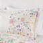 Housse de couette simple avec fonction réversible et motifs floraux en coton colorés et coussin rond