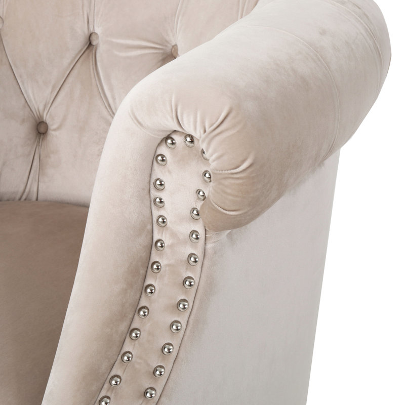 Fauteuil club en velours avec boutons