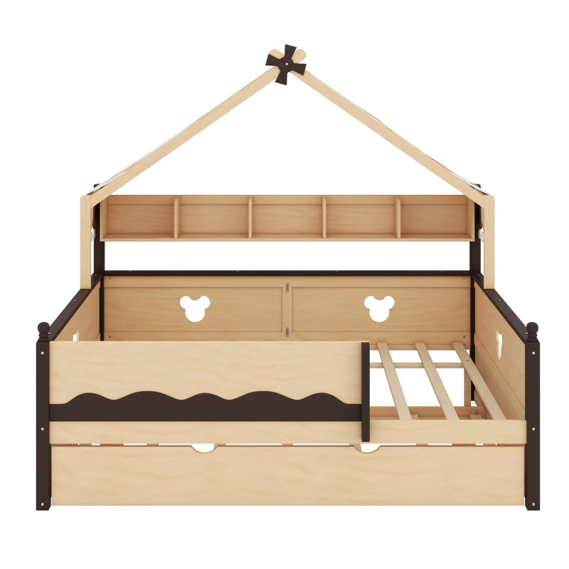 Le lit de jour avec lit gigogne et tablette est doté d'une structure à baldaquin en forme de maison pour les chambres d'enfants.