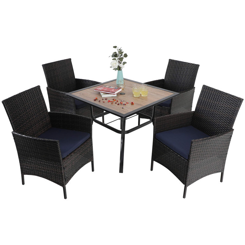 Arnzazu 4 - Person Patio Dining Set with Square Table , Cushions Included