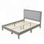 Lit plateforme tapissier en bois massif