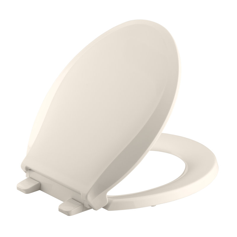 Siège de toilette Kohler Cachet à devant arrondi avec couvercle et fermeture silencieuse, Loquet non prêt, Rose tendre