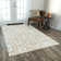 Tapis géométrique ivoire / beige touffeté à la main