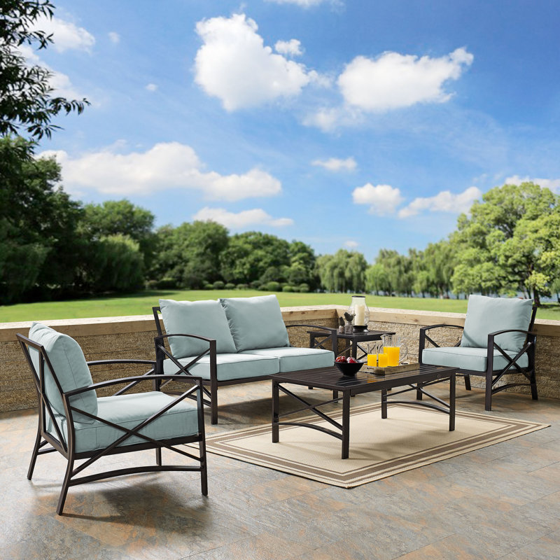 Mosier 4 - Person Patio Conversation Set with Cushions, Mist, Oiled Bronze
