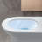 Elongated One-Piece Toilet with Dual Flush Top Button (3/4.8 LPF), Soft-Close D-Shaped Seat, Compact & Durable Design, Easy-Clean Ceramic, White