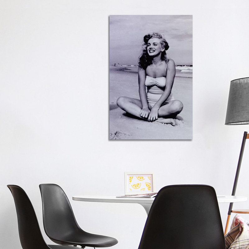 A Young, Smiling Marilyn Monroe Sitting on the Beach by Radio Days - Photograph Print on Canvas, Wrapped Canvas