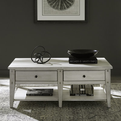 Laron Solid and Manufactured Wood Coffee Table with Push-Through Drawers