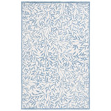Iqarar Hand Tufted Wool/Cotton Floral Rug in Blue/Ivory