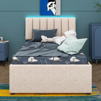 Lit plateforme tapissier de taille simple accompagné d'un lit gigogne sous le lit