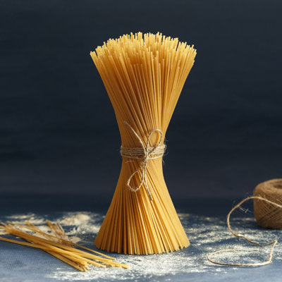 Uncooked Pasta Spaghetti by AnSyvanych - Wrapped Canvas Print