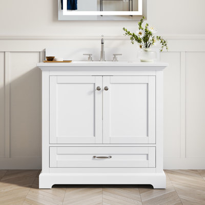 Freestanding Bathroom Vanity With White Cultured Marble Countertop And Sink