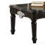 Table basse noire avec pieds tournés