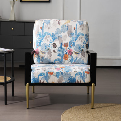 Fauteuil en velours de style rétro avec accoudoirs larges et dossier rembourré pour des pieds à imprimé floral bleu et un cadre en bois d'hévéa confortable