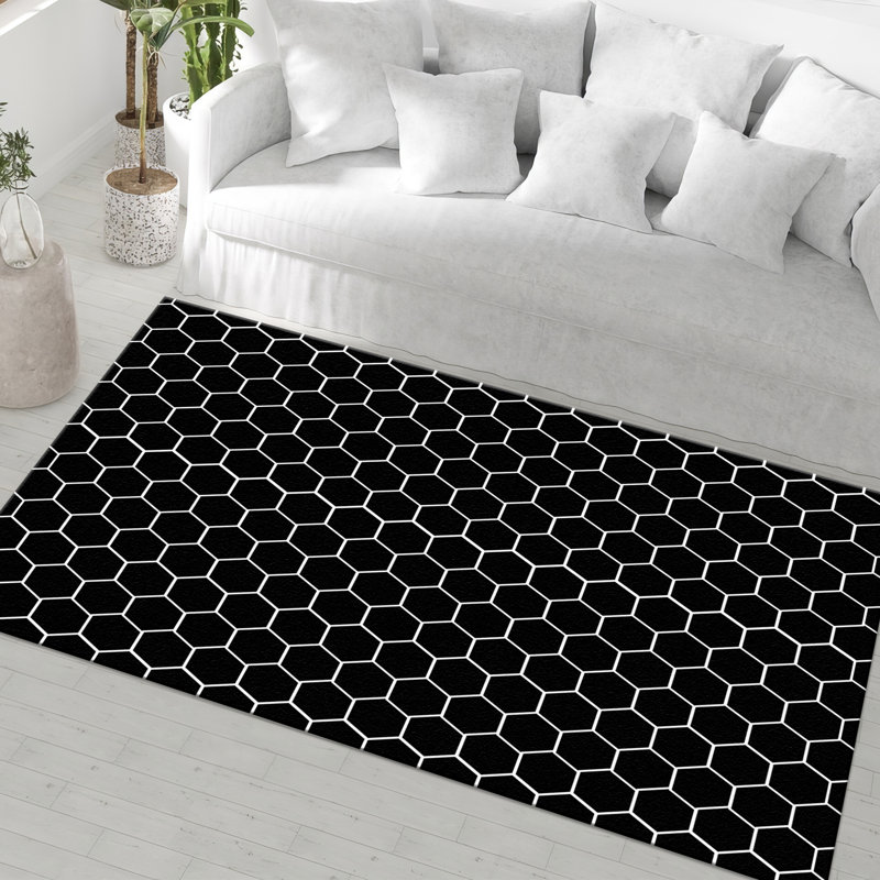Tapis chic et élégant non tissé à motifs tribaux complexes, idéal pour rehausser votre décor