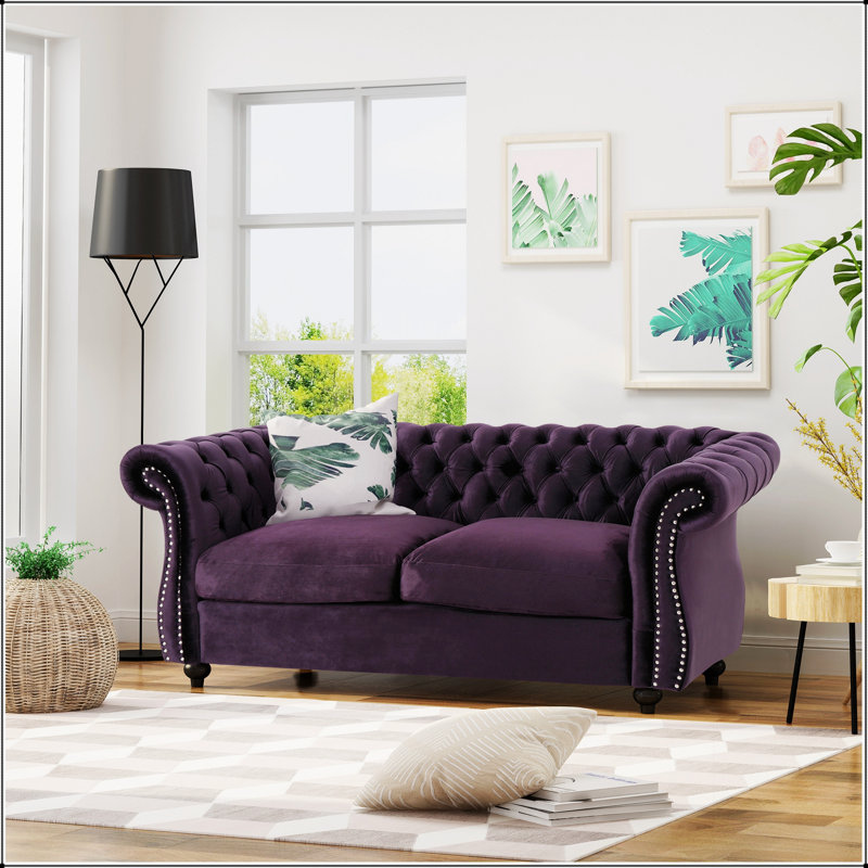 Canapé Chesterfield classique avec capitonnage à boutons profonds et détails cloutés pour une élégance et un confort intemporels