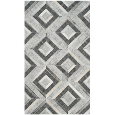 Tapis géométrique en cuir et viscose Sevastopol Studio