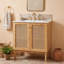 Meuble-lavabo de salle de bain avec lavabo en céramique et portes en rotin