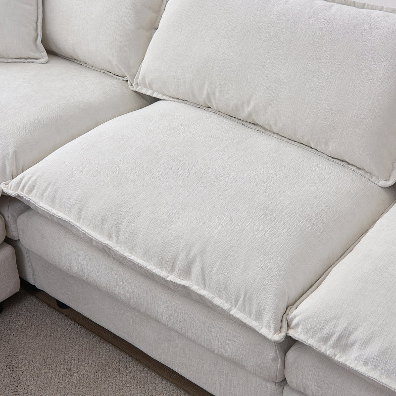Canapé modulaire en L de 105 po avec repose-pieds, revêtement en chenille souple et sièges spacieux pour la vie moderne.
