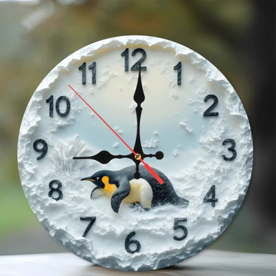 Horloge enneigée pingouin
