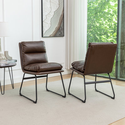 2 Piece Dining Chairs, Antique Brown. Sled Base For Steadiness. Comfy Overfilled Seat Back. Faux Leather Upholstery. Metal Structure. Wipe Clean Chair