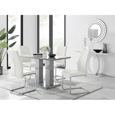 Edzard Double Pedestal High Gloss Dining Table Set with 4 Luxury Faux Leather Dining Chairs