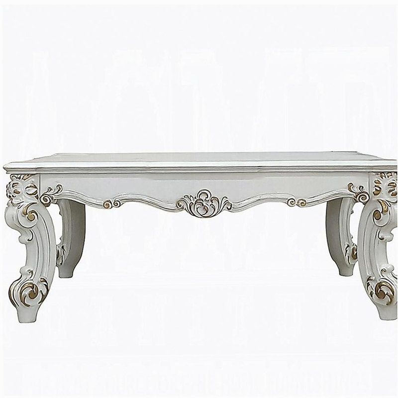 Table basse en perle antique avec pieds en volute