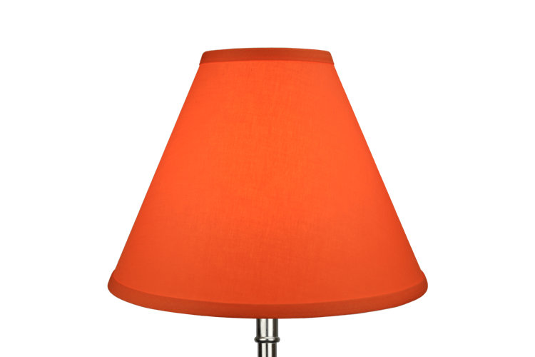 Empire shaped red orange lamp shade that has a sleek mid-century modern feel.