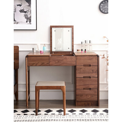 Modern minimalist black walnut dressing table with concealed flip-top vanity.