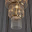 Geira Grand 21lt Tiered Pendant light finished in Ant. Brass
