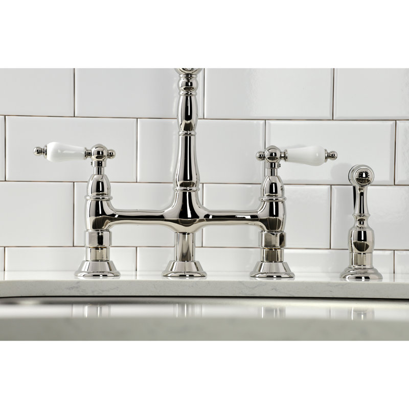 Kingston Brass Heritage Two-Handle 4-Hole Deck Mount Bridge Kitchen Faucet with Brass Side Sprayer, Polished Nickel/White