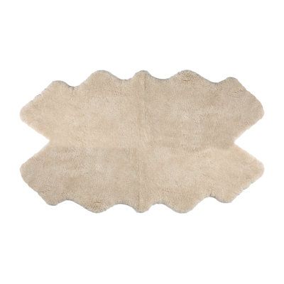 Four pelt shorn curly sheepskin rug