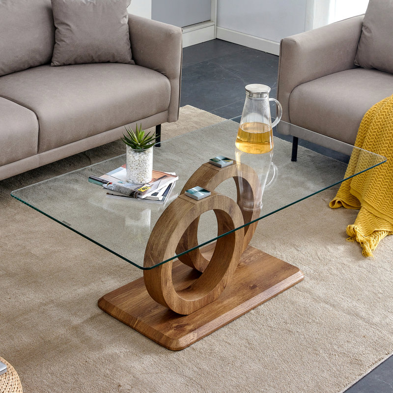 Une table basse rectangulaire moderne et tendance avec un plateau en verre trempé et des pieds en grain de bois. Convient au salon: 47,2 po x 25,4 po x 17,9 po