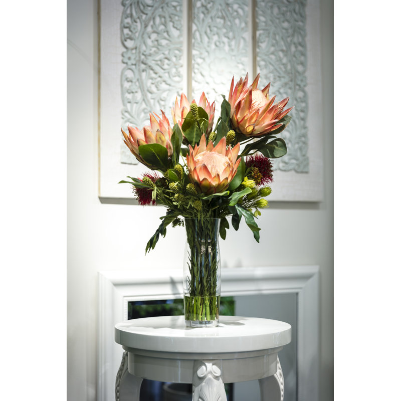 Protea/Leucospermum dans un vase en verre