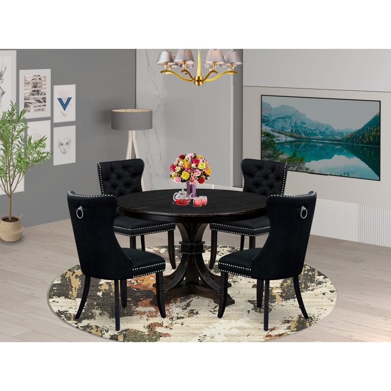 L'ensemble de salle à manger 5 pièces pour 4 personnes comprend une table ronde de 48 po avec piédestal et 4 chaises Parson en polyester noir, noir sablé