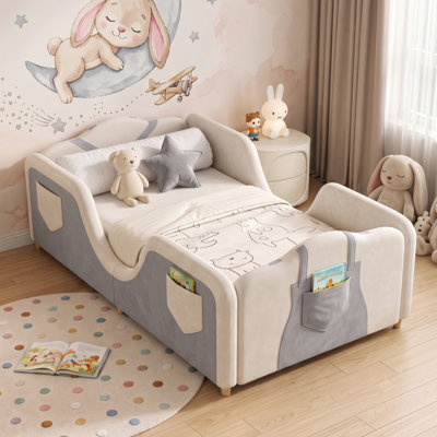 Overalls-Inspired Upholstered Toddler Bed with 6 Storage Pockets, Crib Size Kids Bed with Soft Padded Guardrails, Low Profile Transition Bed for Boys & Girls, 4 Colors Available