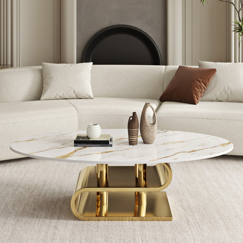 Table basse ovale moderne en pierre frittée avec piètement en métal doré double couche pour salon