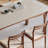 A stone dining table with a beechwood frame-142422540-142422539